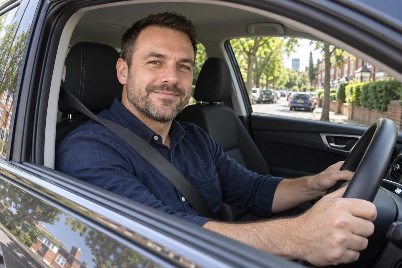 A relaxed adult driver at the wheel during a refresher lesson